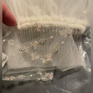 Beautiful, New, David’s Bridal fingertip veil.